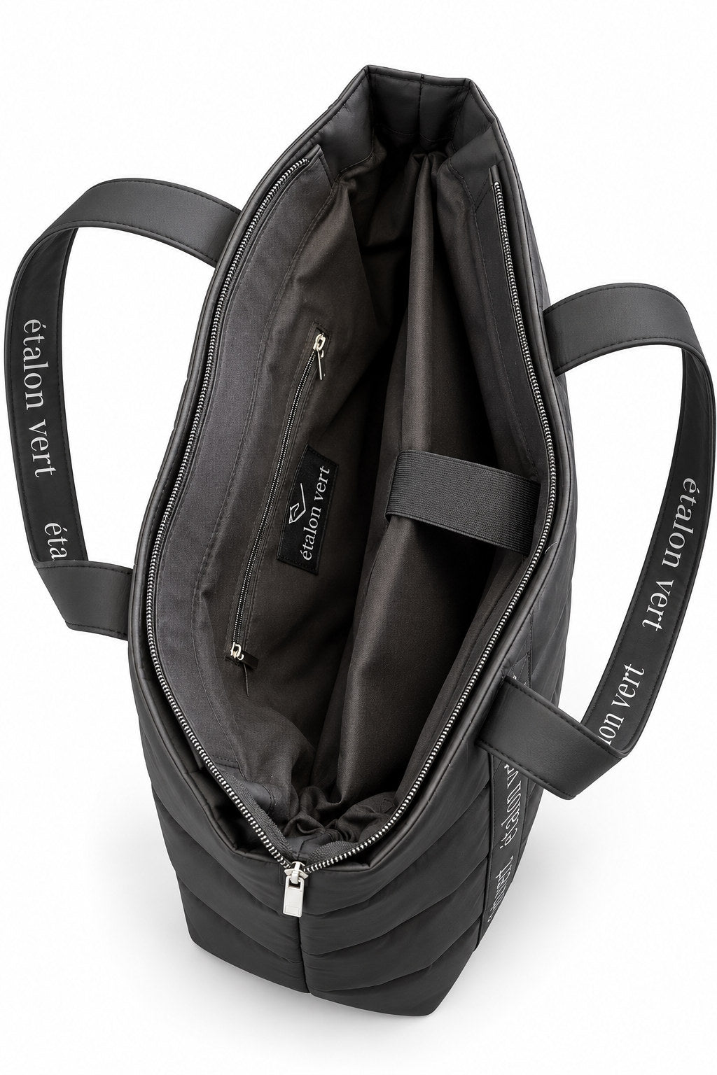Puffer Bag Black – geöffneter Innenraum mit Hauptfach und separatem Laptop-Fach mit Lasche